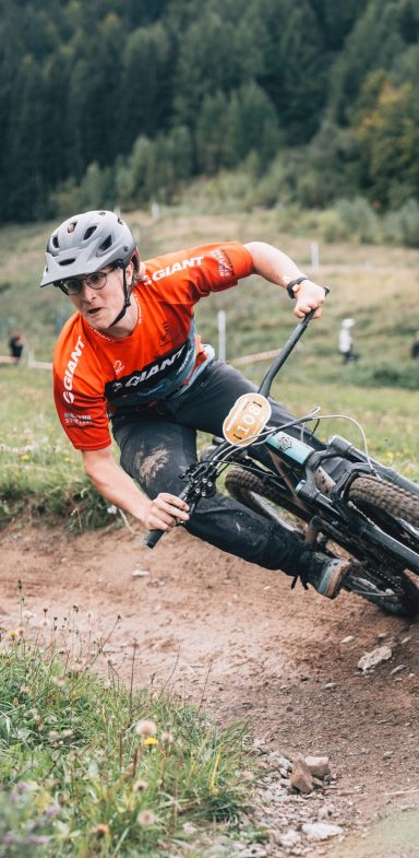 Franz leans into a curve during a mountain bike race